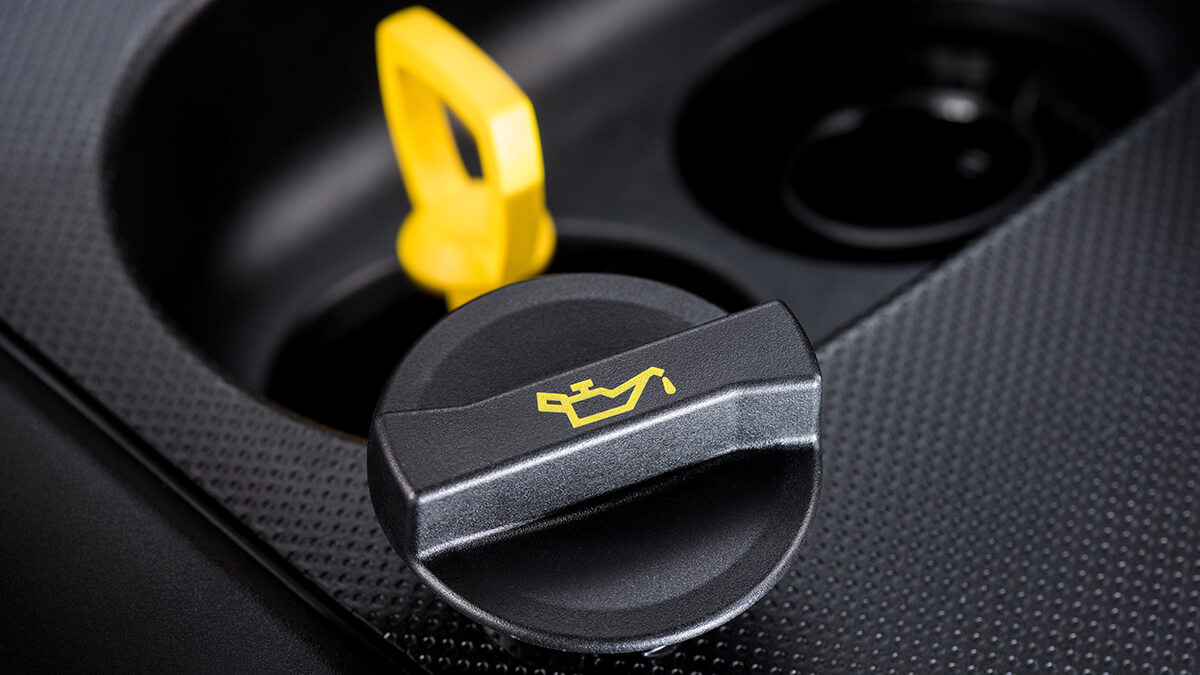 A close-up of engine showing engine oil cap