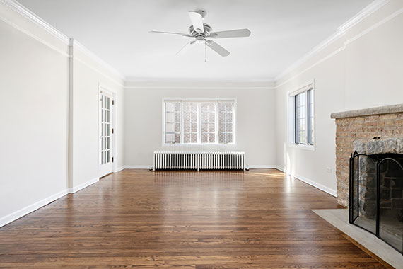 Sunlight pours in the windows of a vacant home.