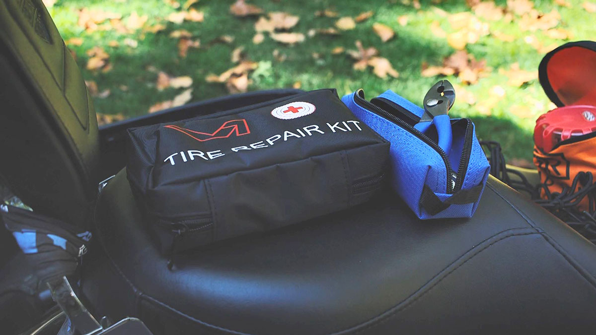 A close up of emergency lights and flares sitting on motorcycle